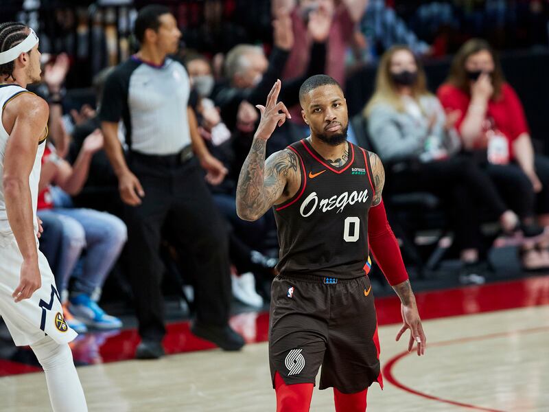 Portland Trail Blazers guard Damian Lillard reacts after making a 3-pointer against the Denver Nuggets in Game 6 of their playoff series.