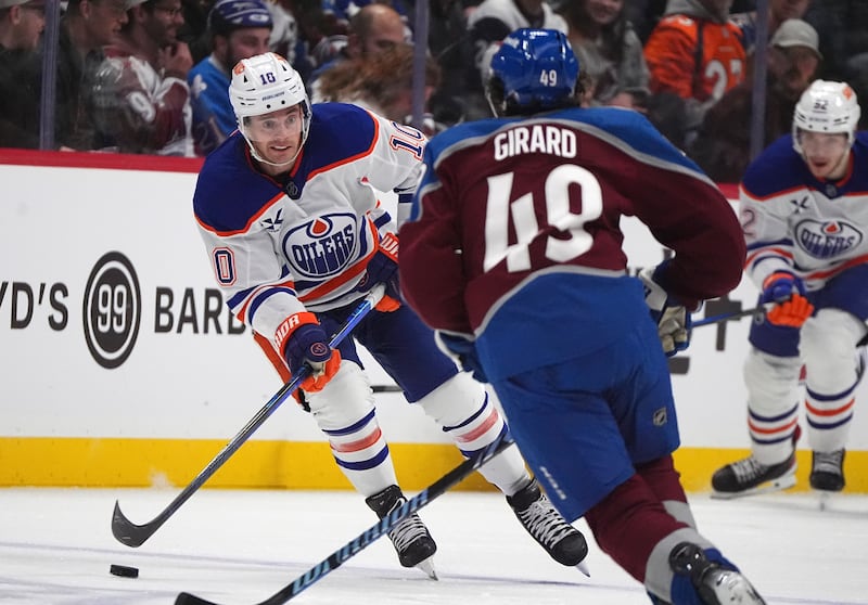 Edmonton Oilers center Derek Ryan (10) looks to pass the puck as Colorado Avalanche defenseman Samuel Girard (49) covers Saturday, Nov. 30, 2024, in Denver.