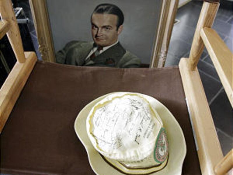 A chair from Bob Hope's days at NBC, a painting and a golf hat are among items that will be sold at a charity auction.