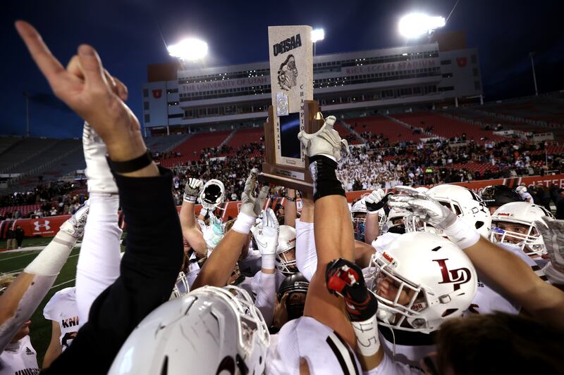 Lone Peak celebrates after defeating Corner Canyon for the 6A football championship at Rice-Eccles Stadium in Salt Lake City on Friday, Nov. 19, 2021. Lone Peak won the 6A All-Sports award this school year.