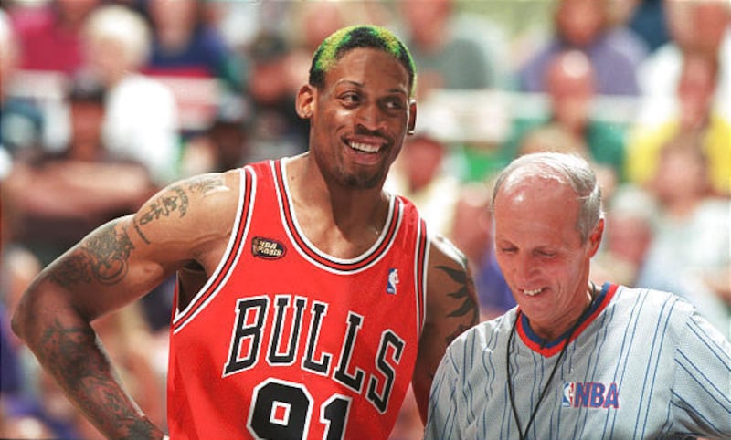 Dennis Rodman and referee Dick Bavetta share a laugh during Game 6 of the NBA finals at the Delta Center on June 14, 1998.