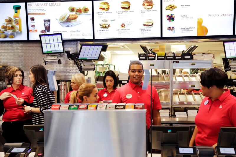 Employees familiarize themselves with the new Chick-fil-A restaurant, Thursday, Oct. 1, 2015 in New York. The Atlanta-based privately held franchise company has more than 1900 restaurants in 41 states and Washington, D.C. The New York franchise, located a