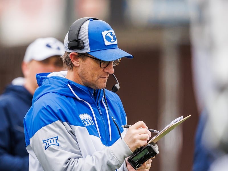 BYU offensive coordinator Aaron Roderick examines his play sheet during a practice at BYU's outdoor practice facility in Provo.