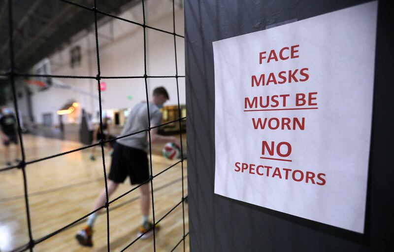 Face mask requirement signs are posted in Sport City as Club GSL practices volleyball in Draper on Monday, Nov. 9, 2020.