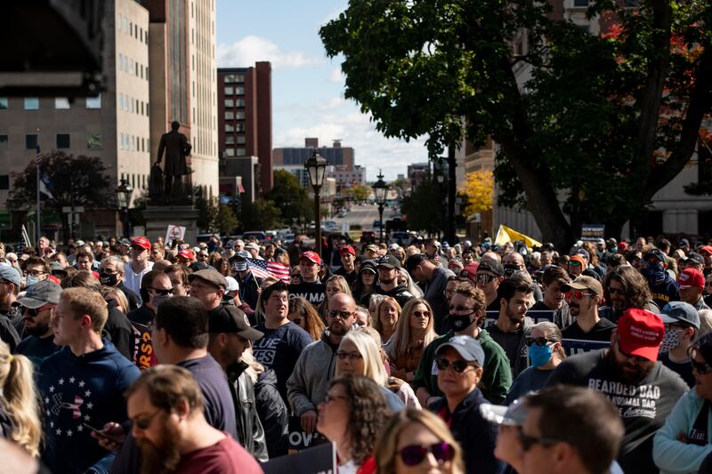 Rally goers gather at the Capitol and listen as Steven Crowder speaks during his protest against Gov. Gretchen Whitmer at the Michigan State capitol in Lansing, Mich., on Friday, Oct. 2, 2020. Crowder focused on Whitmer’s decisions regarding seniors with COVID-19.