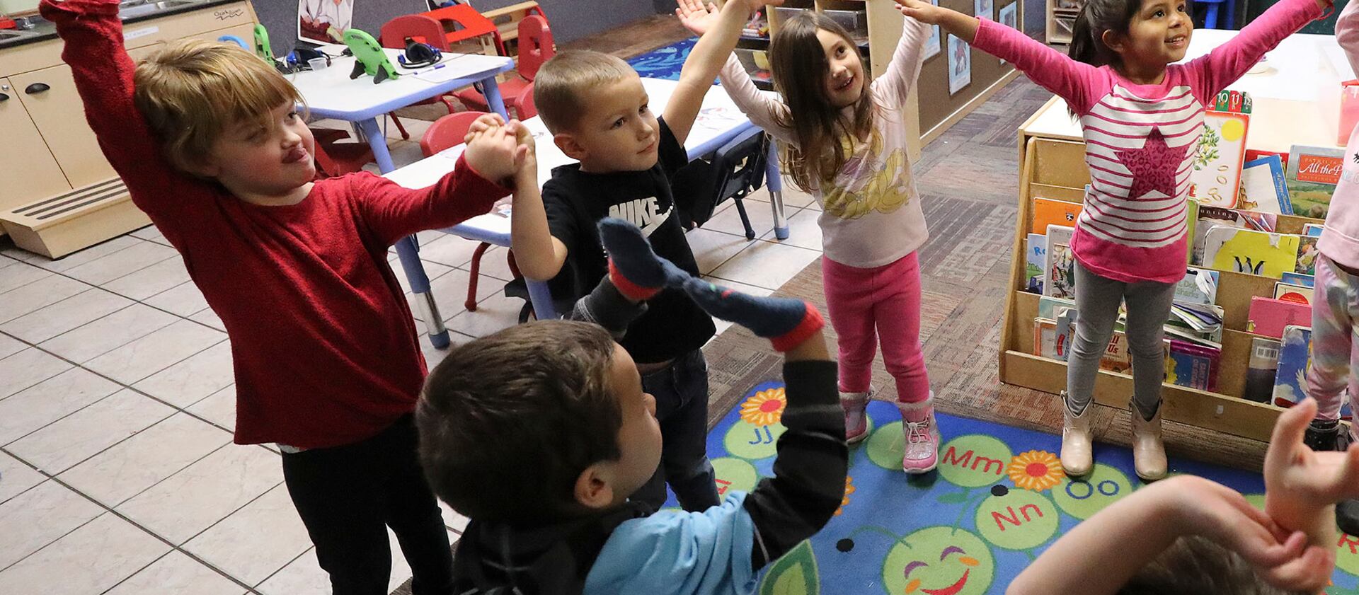 Preschool students play a game at A to Z Building Blocks in Orem.