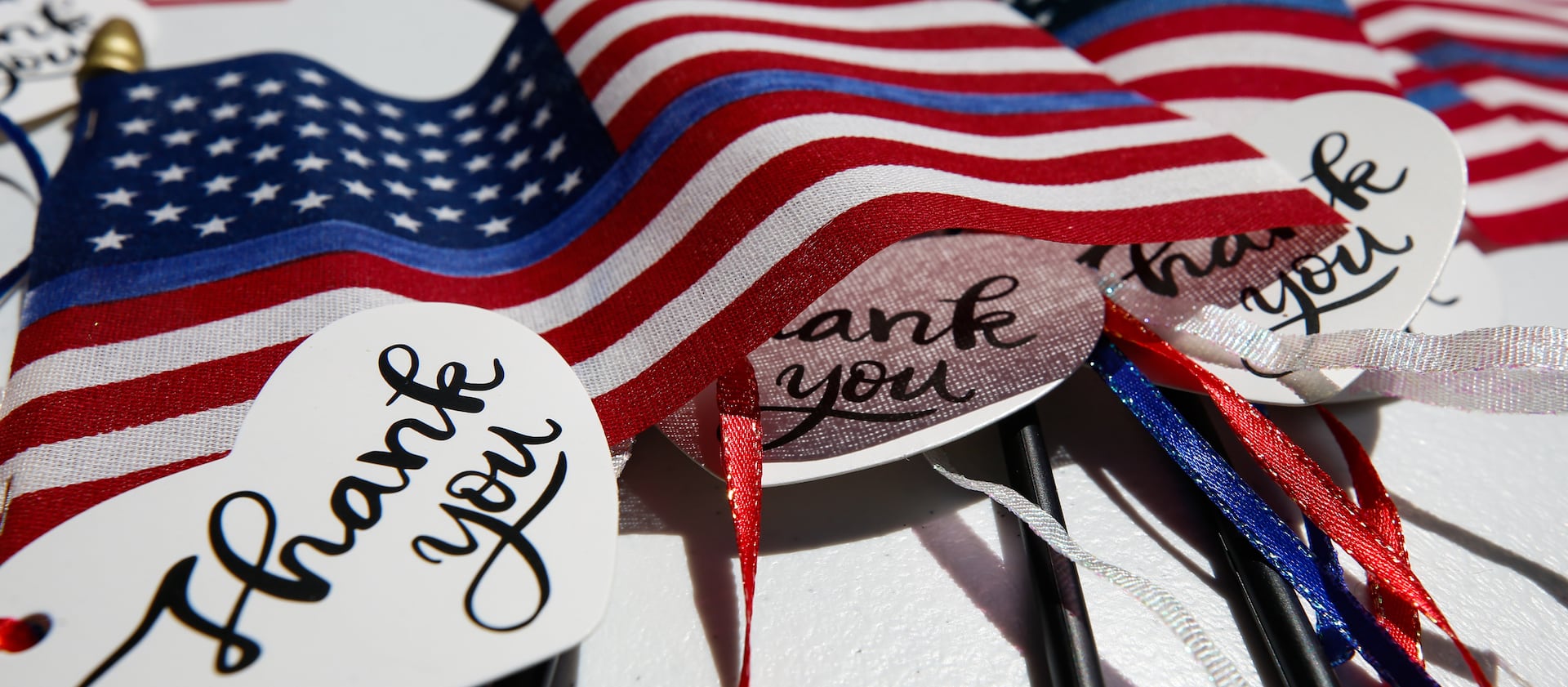 American flags are laid out for people to pick up during a rally supporting law enforcement.