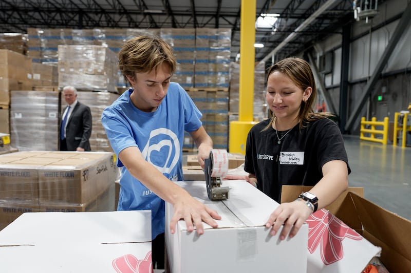 JustServe volunteers assemble food kits at the Bishops' Central Storehouse in Salt Lake City, Utah, on Thursday, Nov. 13, 2025
