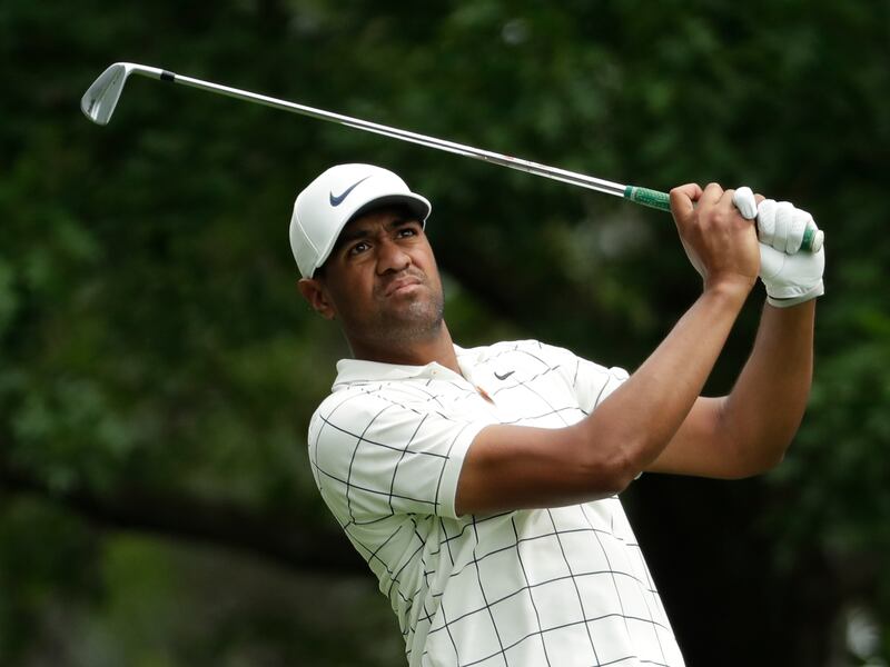 Tony Finau hits from the fourth tee during the third round for the Masters golf tournament Saturday, April 13, 2019, in Augusta, Ga. (AP Photo/Chris Carlson)