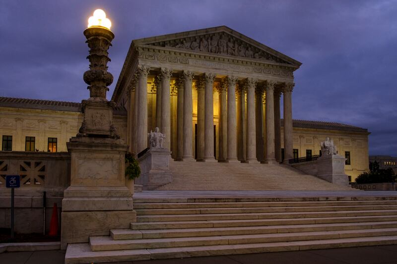 FILE - In this Oct. 5, 2018, file photo, the U. S. Supreme Court building stands quietly before dawn in Washington. The Constitution says you can’t be tried twice for the same offense. And yet Terance Gamble is sitting in prison today because he was prose