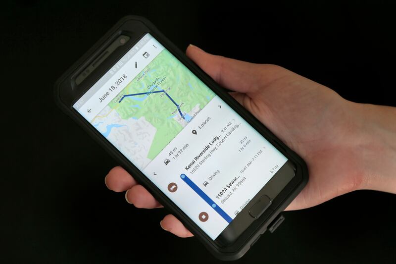 A mobile phone displays a user’s travels using Google Maps in New York.
