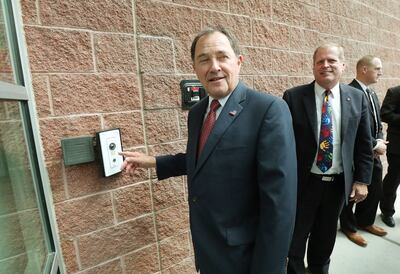 Gov. Gary Herbert looks over asecurity door camera as he tours Rose Springs Elementary School in Stansbury Park on Wednesday, Aug. 22, 2018. During his visit, Herbert looked over school safety measures and met with Tooele County School District counselors