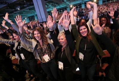 Attendees dance as Dr. Peter Lovatt prompts them while talking about the psychology of dance during the Qualtrics summit at the Salt Palace Convention Center in Salt Lake City on Wednesday, March 6, 2019.