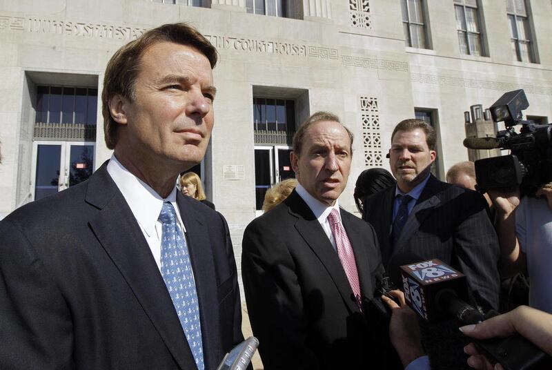 FILE - In an Oct. 27, 2011 file photo, former U.S. Sen. and presidential candidate John Edwards, left, speaks to the media with attorney Abbe Lowell, right, as he leaves the federal court in Greensboro, N.C. Prosecutors and defense lawyers in the John Ed