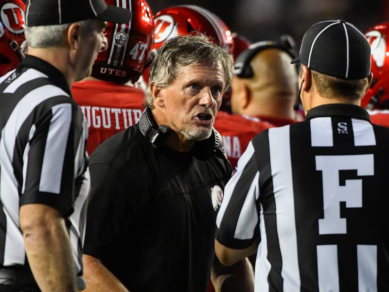 Utah coach Kyle Whittingham speaks to the referees during game against BYU game Saturday, Sept. 11, 2021, in Provo, Utah.