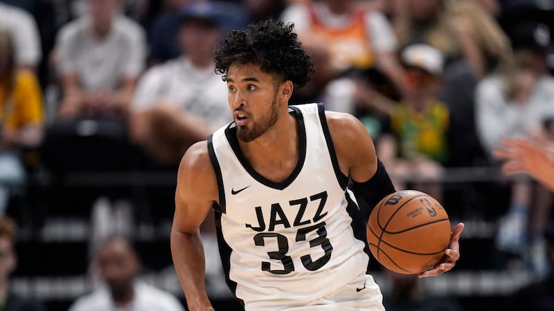 Utah Jazz guard Johnny Juzang (33) brings the ball up court in the second half during an NBA summer league basketball game against the Memphis Grizzlies Thursday, July 6, 2023, in Salt Lake City. (AP Photo/Rick Bowmer)