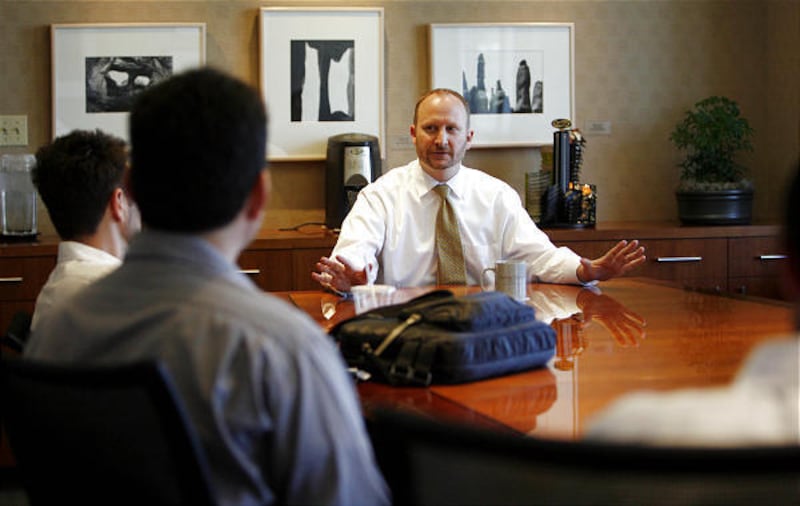 Attorney and class adviser Troy Booher begins a session with a group of second-year law students at the University of Utah in August.