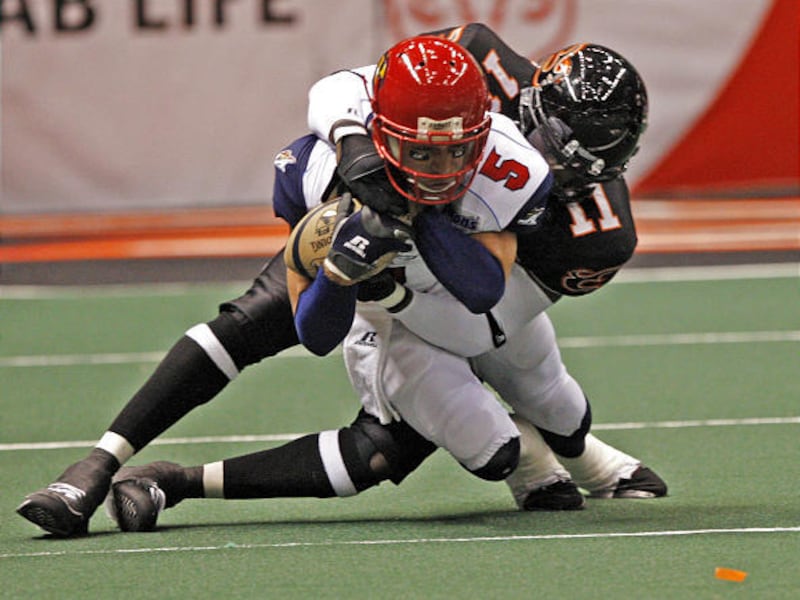 Utah's Kelvin Morris tackles L.A. quarterback Kevin Ingram during Monday's game at the EnergySolutions Arena. Morris returned a fumble in the fourth quarter to seal a win.