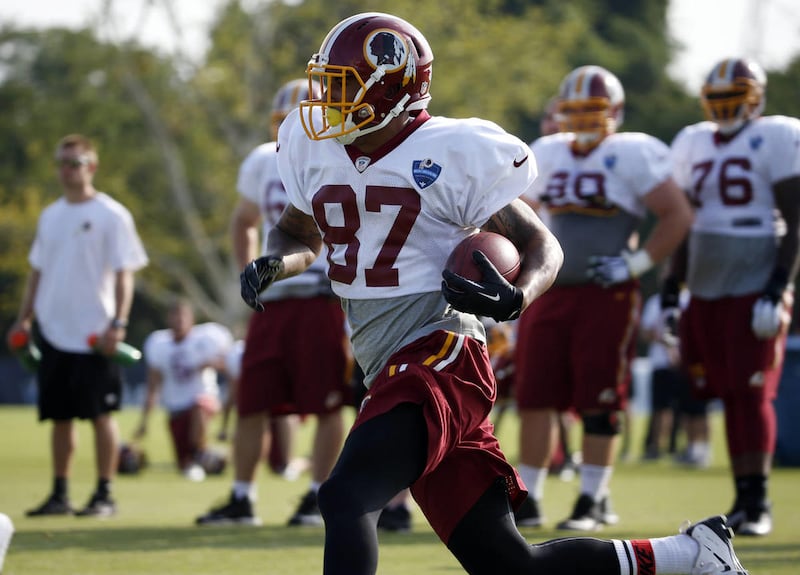 Washington Redskins receiver Cody Hoffman runs with the ball during practice at the team's NFL football training facility, Saturday, July 26, 2014 in Richmond, Va. The former Cougar was waived by the Redskins in August, but according to the Baltimore Sun'