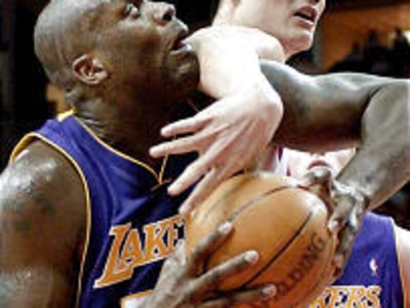 The Lakers' Shaquille O'Neal, left, and the Rockets' Yao Ming will be centers of attention in the L.A.-Houston first-round series.