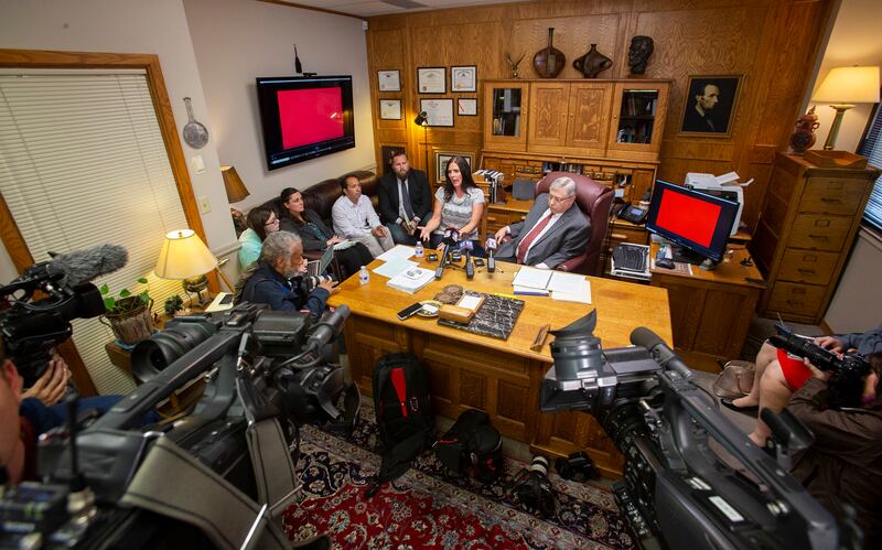 Brenda Mayes and her attorney, Robert Sykes, hold a press conference at Sykes office in Salt Lake City on Tuesday, May 7, 2019. A civil rights lawsuit filed in U.S. District Court says a Davis School District bus driver "was driven by racial animus to com