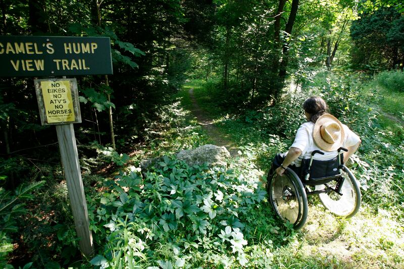 Deborah Lisi-Baker starts her wheelchair up the View Trail at Camel’s Hump in Duxbury, Vt., Thursday, July 26, 2007.