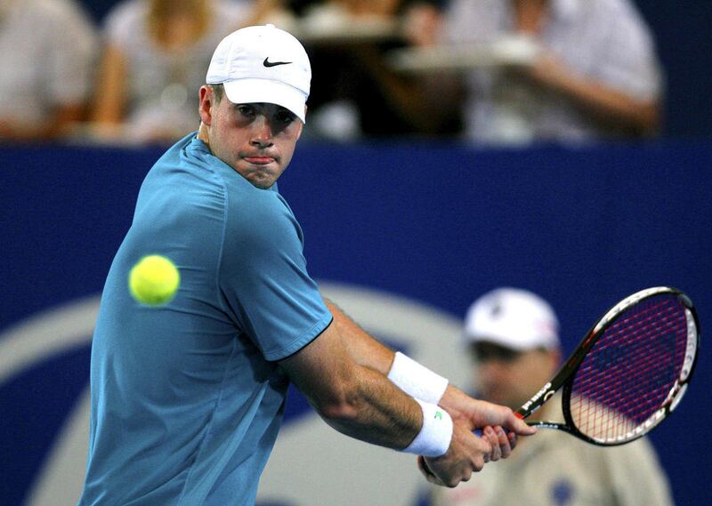 FILE - In a Jan. 5, 2010 file photo, John Isner of the United States plays against Australia's Lleyton Hewitt during their men's singles match at the Hopman Cup tennis tournament in Perth, Australia. Isner defeated Nicolas Mahut 6-3, 7-6 (5) Monday, Jan.
