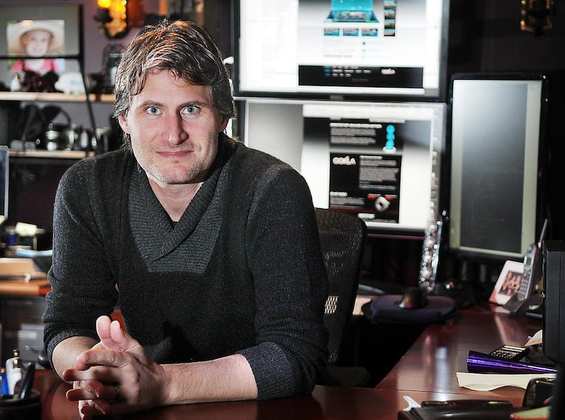 In this March 2, 2011 photo, Mike Apgar, chief executive officer of Ookla, a startup venture he co-founded in 2006, poses in his home office in Kalispell, Mont. More than three million times a day, Internet users tap into Ookla's free and licensed diagnos