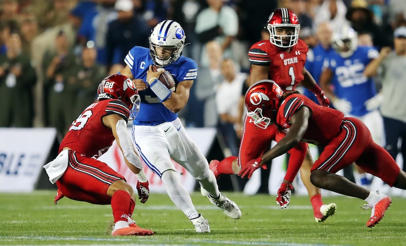 BYU Cougars quarterback Jaren Hall slides down after a run as BYU and Utah play.