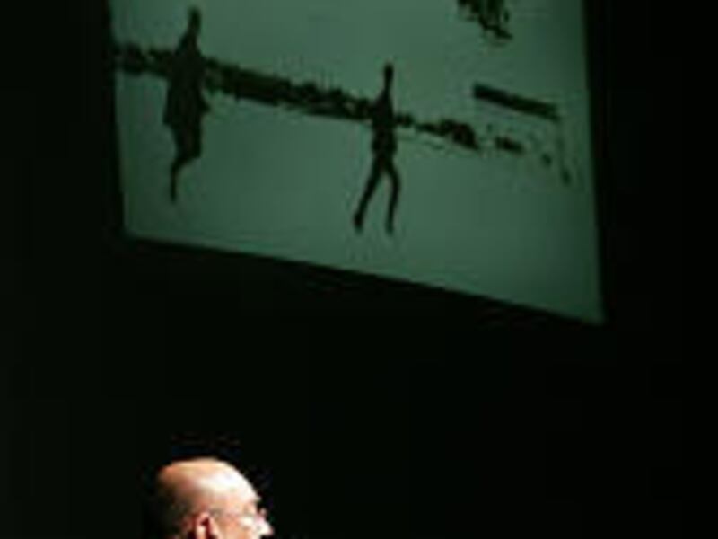 Sergei Sikorsky shows slides of early events in aviation history during his UVSC presentation.