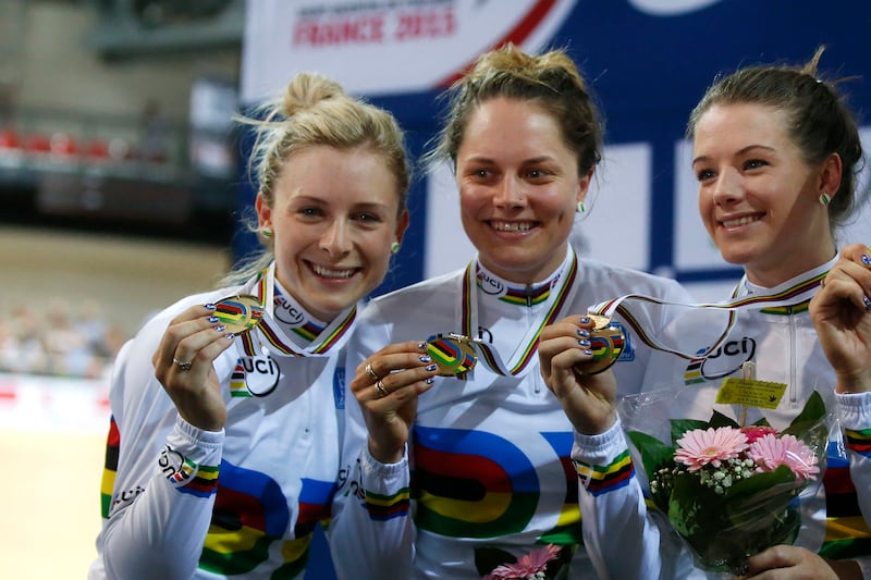 The Australian team, from left, Melissa Hoskins, Amy Cure, Ashlee Ankudinoff and Annette Emonodson, unseen, celebrate during the women’s team pursuit race medal ceremony at the Track Cycling World Championships in 2015.