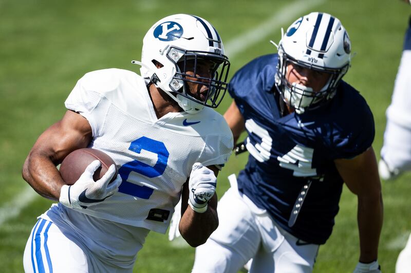 BYU running back Chris Brooks carries the ball during final scrimmage of fall camp at LaVell Edwards Stadium.