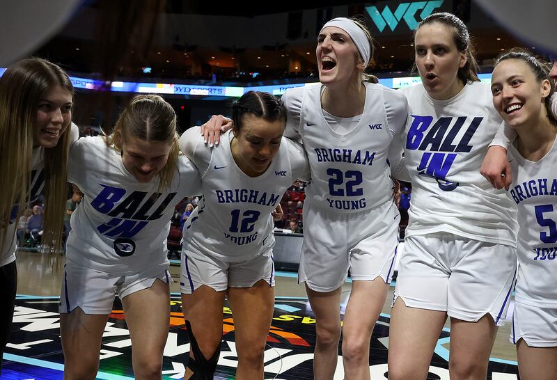 BYU players celebrate advancing to final round of the WCC Women’s Basketball Tournament after beating Portland in Las Vegas.