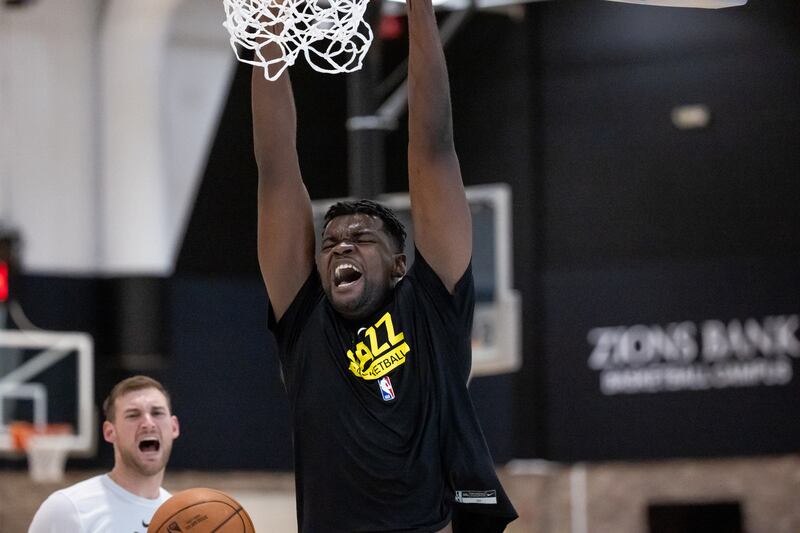 Jazz center Udoka Azubuike dunks while shooting around at the end of a Utah Jazz practice at the Zions Bank Basketball Campus.