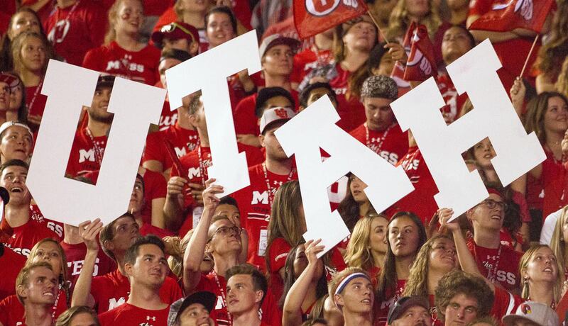 Utah Utes fans hold up signs during an NCAA football game against the Brigham Young Cougars in Salt Lake City on Saturday, Sept. 10, 2016. Utah defeated BYU 20-19 for its sixth-consecutive win.
