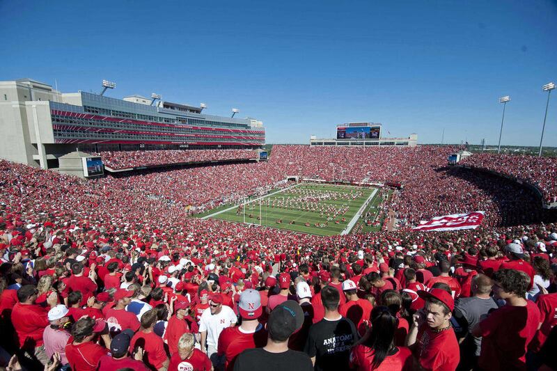 FILE - In this Sept. 11, 2010, file photo, fans look on during a college football game at Nebraska's Memorial Stadium in Lincoln, Neb. The Nebraska athletic program wants to increase the scope of the expansion of 87-year-old Memorial Stadium, originally a
