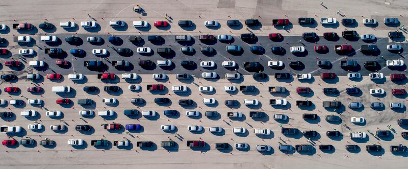 People line up in their vehicles for COVID-19 vaccines at a mass vaccination site at Circuit of the Americas in Austin, Texas, Saturday, March 6, 2021. Former CDC Dr. Richard Besser explained Tuesday what the new CDC guidelines for vaccinated people mean for the country