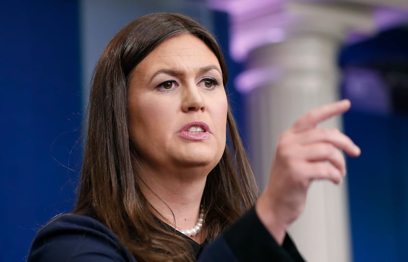 White House press secretary Sarah Huckabee Sanders points to a questioner during a press briefing at the White House.