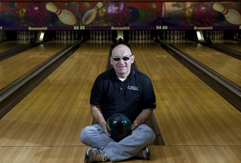 Ron Gooch, 52, sits in lane at Echo Lanes in Morris, Illinois, September 27, 2010. Legally blind, Gooch rolled a perfect 300 game earlier this month and is one of a handful of blind bowlers ever to achieve the high score.
