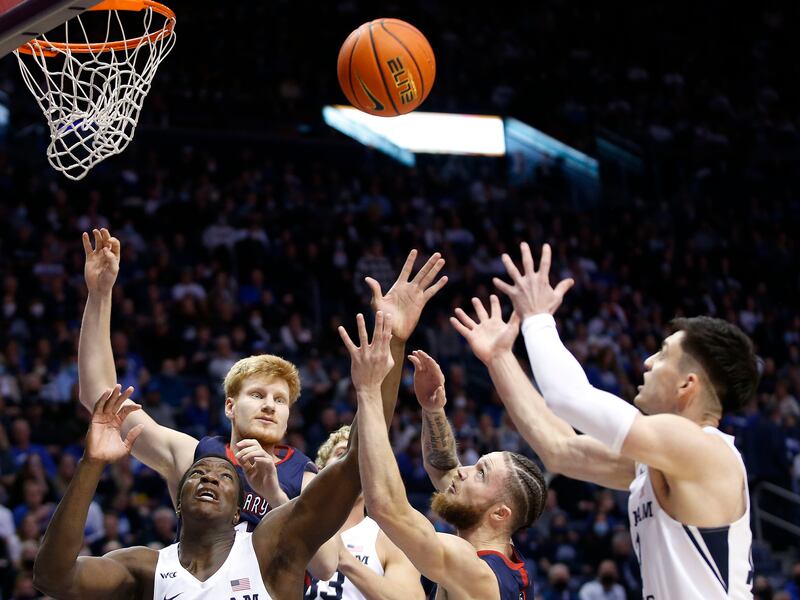 Brigham Young Cougars and St. Mary’s Gaels compete for the ball in Provo on Saturday, Jan. 8, 2022.