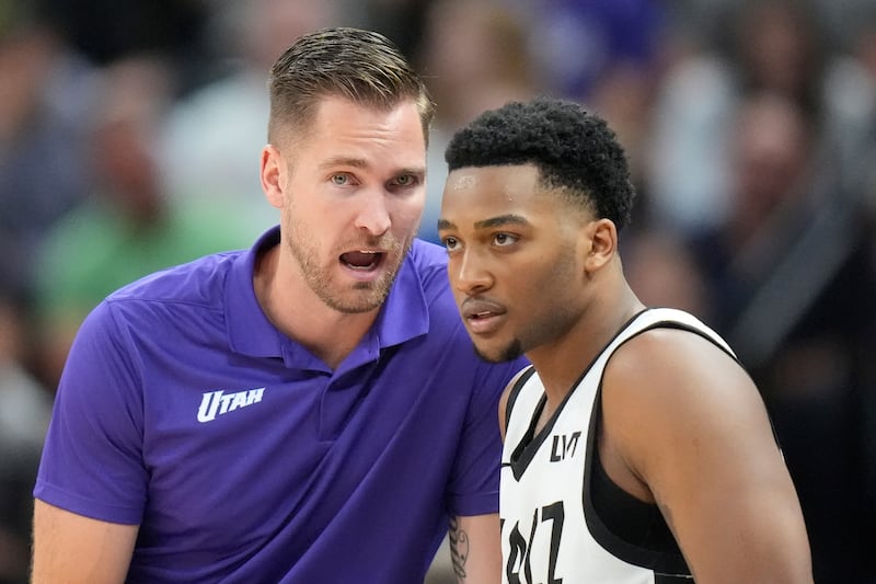 Utah Jazz Summer League head coach Sean Sheldon, left, speaks with Brice Sensabaugh during game against the Philadelphia 76ers, Wednesday, July 10, 2024, in Salt Lake City.
