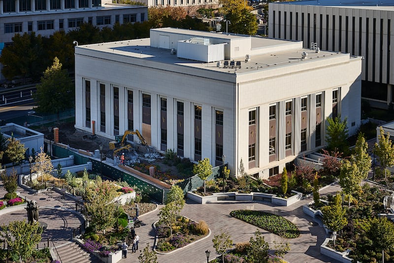 Crews work on the exterior of the Relief Society Building on Temple Square on Wednesday, Oct. 22, 2025.