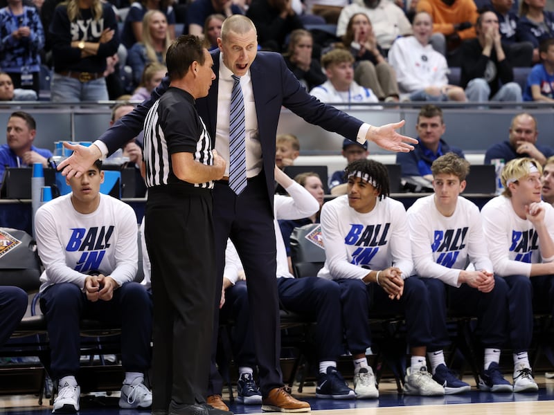 BYU Cougars head coach Mark Pope argues with a referee as BYU and Washington State play in the NIT quarterfinals in 2022.