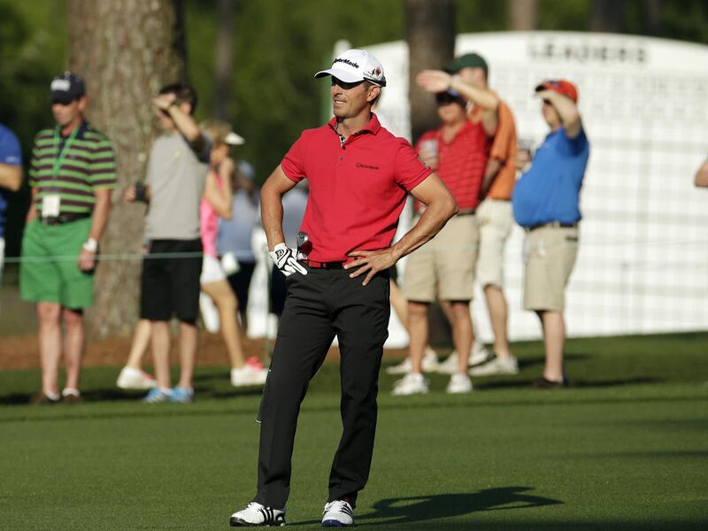 Mike Weir, of Canada, watches his shot on the second fairway during the first round of the Masters golf tournament Thursday, April 9, 2015, in Augusta, Ga.