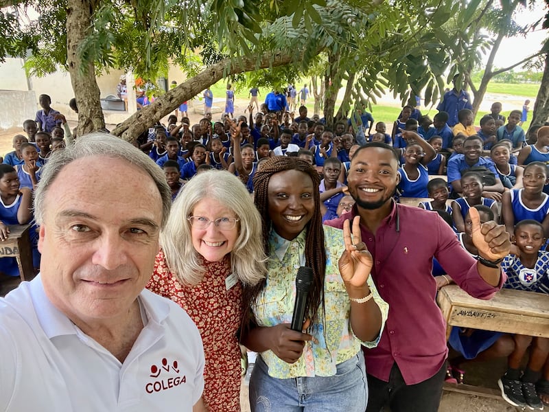 Latter-day Saint senior missionaries, teachers and children in Ghana pause for a photo during a lesson about human rights in 2025.