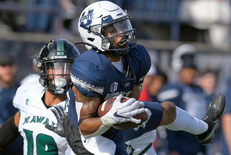 Utah State wide receiver Deven Thompkins (13) catches a pass.