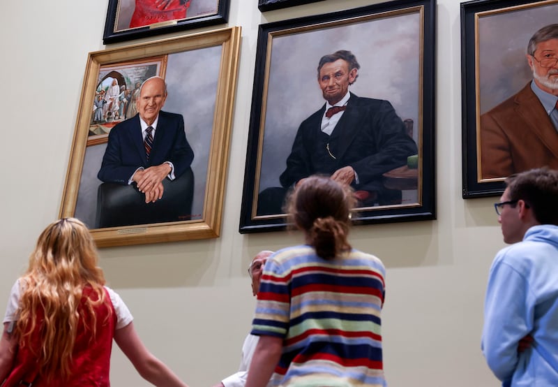 An oil portrait of President Russell M. Nelson of The Church of Jesus Christ of Latter-day Saints, left, hangs in the International Hall of Honor with Abraham Lincoln and Dr. Ira Helfand at the Martin Luther King Jr. International Chapel at Morehouse College in Atlanta, Georgia.