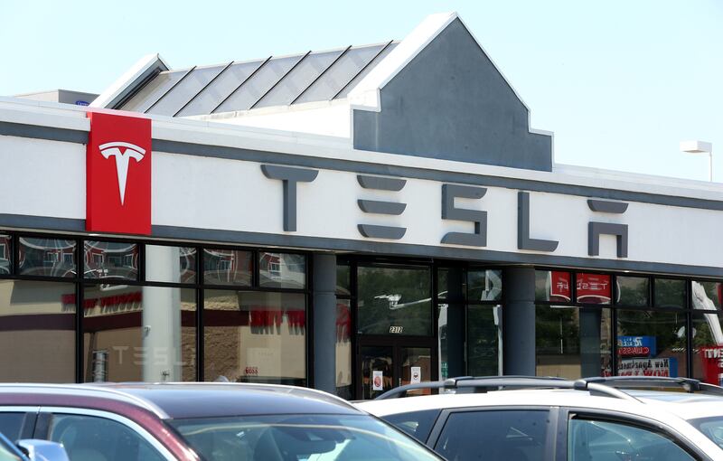 The Tesla dealership in Salt Lake City is pictured on Tuesday, July 21, 2020. A new report from Wells Fargo shows U.S. retail volumes are nearly back to pre-pandemic levels, even though the list of “winners” and “losers” has changed dramatically due to fallout from COVID-19.