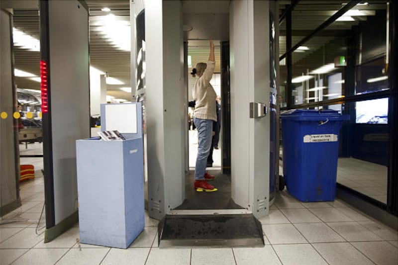 A passenger is checked inside one of the new, full-body scanners Monday at Schiphol Airport in the Netherlands.