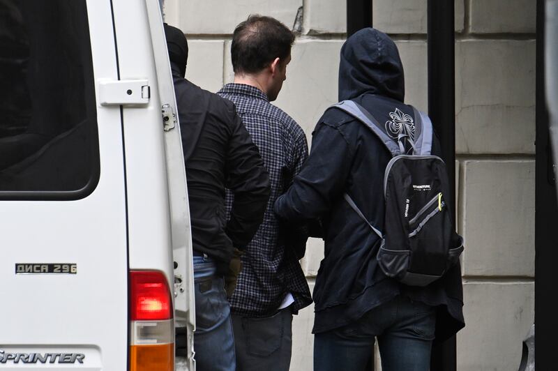 Wall Street Journal reporter Evan Gershkovich is escorted to the Lefortovsky court in Moscow, Russia